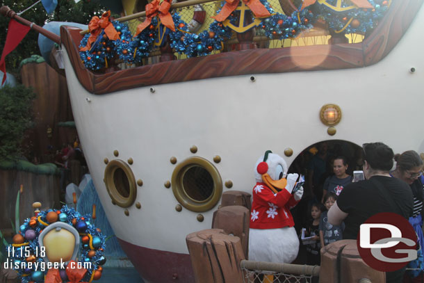 Donald greeting guests in front of his boat.