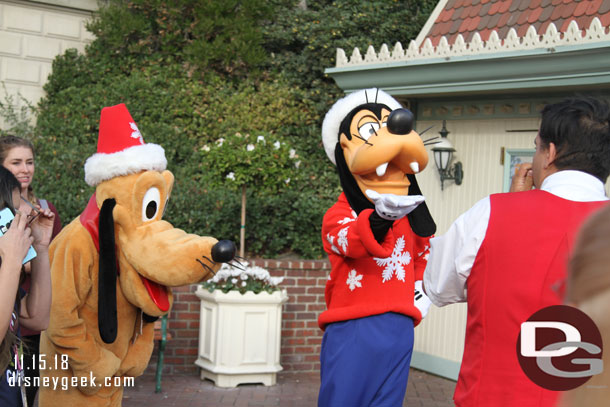 Goofy and Pluto meeting guests near the entrance.