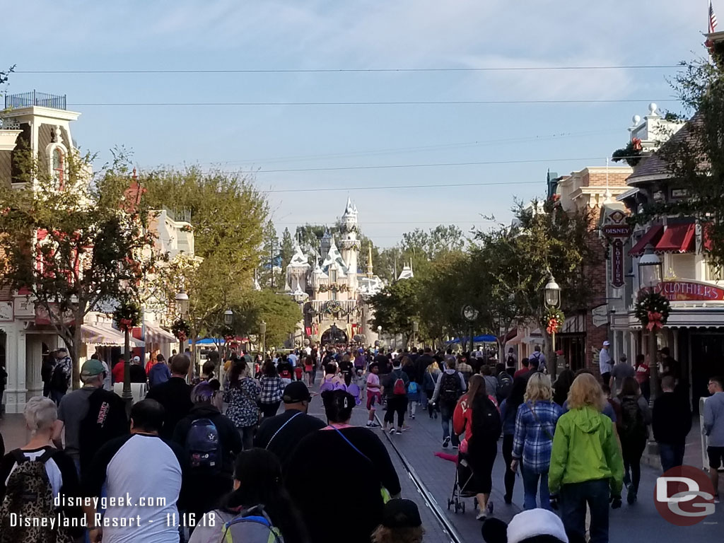 Making my way up Main Street, 5 minutes until park opening.  Notice the support cables for the garland were installed last night now that the taping is over.