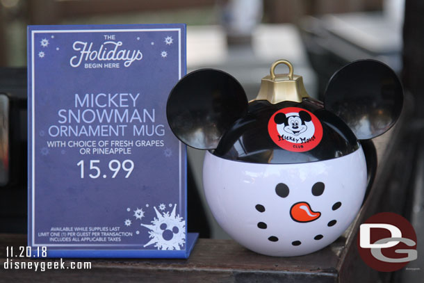 Mickey Snowman Ornament Mugs are available at several locations with various items inside.  This is at Fillmores.