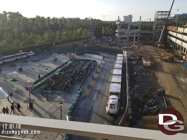 A wide view of the tram stop.  The queue is for guests heading toward security.