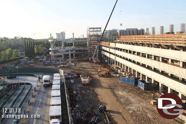 Panning left.  Crews working on the escalator structure and far section of the garage.