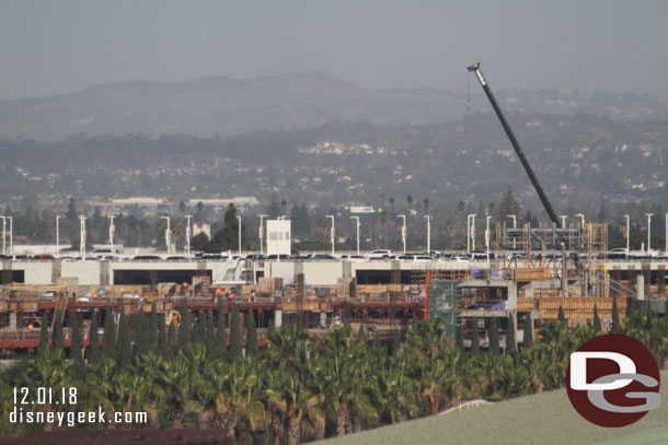 The new parking structure rising above the treeline.