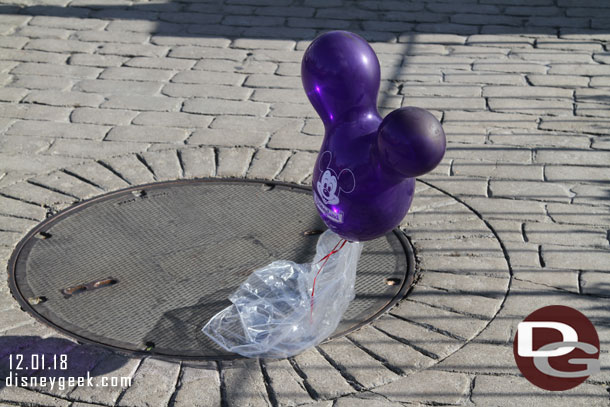 A purple balloon floating around New Orleans Square.