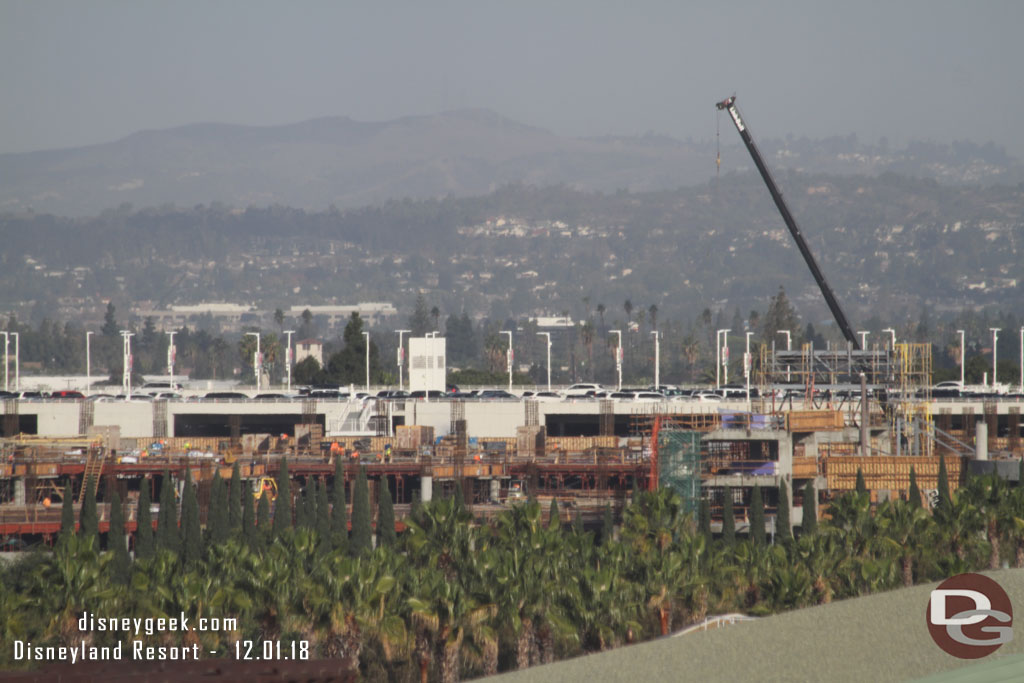 The new parking structure rising above the treeline.