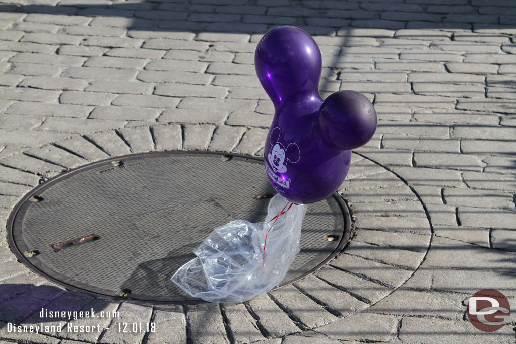 A purple balloon floating around New Orleans Square.