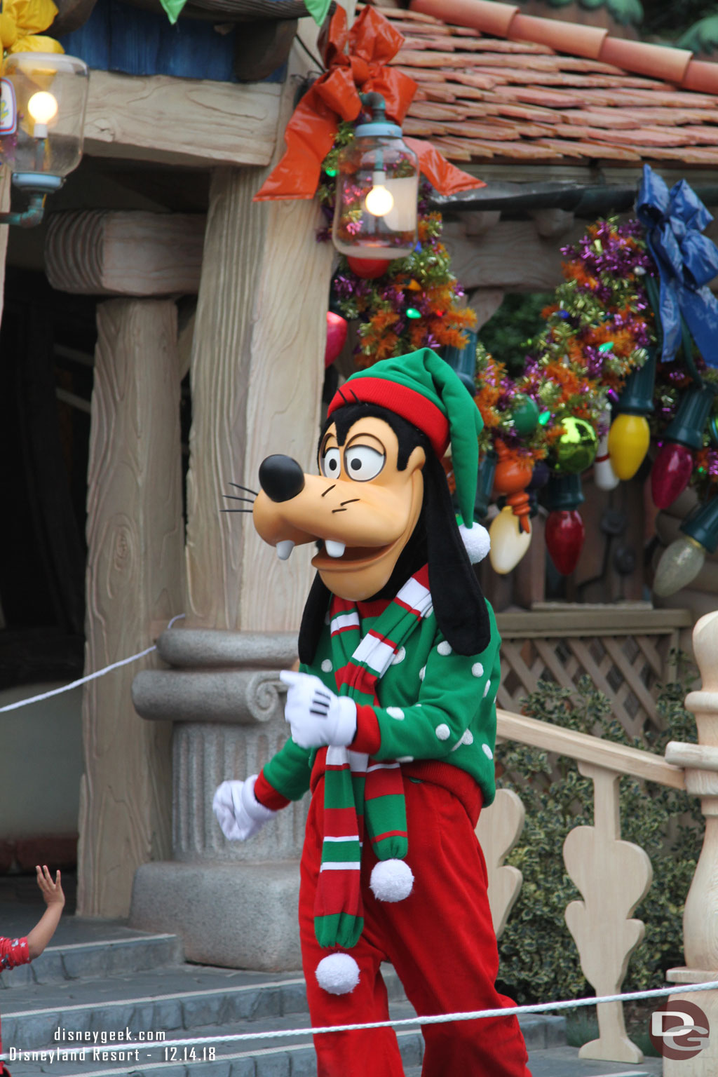 Goofy greeting guests near his house.