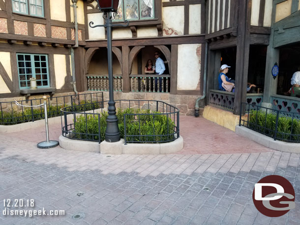 The walls are down and the planters have been reconfigured/shrunk to allow for a small queue space for the disability access queue.