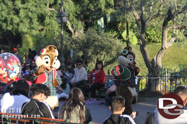 Chip and Dale walk behind the float since they lost their spot to Santa.