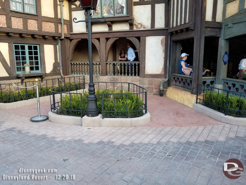 The walls are down and the planters have been reconfigured/shrunk to allow for a small queue space for the disability access queue.