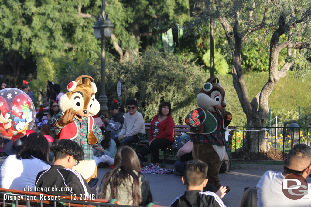 Chip and Dale walk behind the float since they lost their spot to Santa.