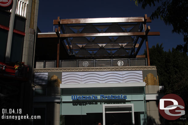 The outdoor patio area over Wetzel's Pretzels looks complete.