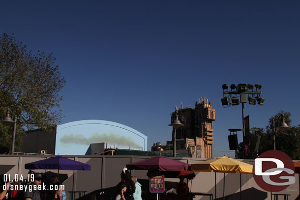 The large mound of dirt is no longer visible.  No other visible change from ground level.