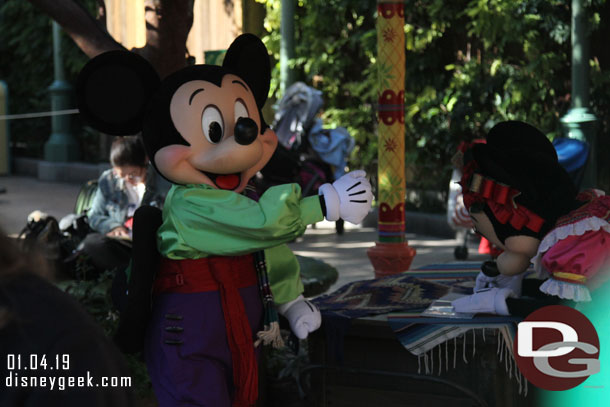 Mickey and Minnie signing autograph books at the Viva Navidad celebration.