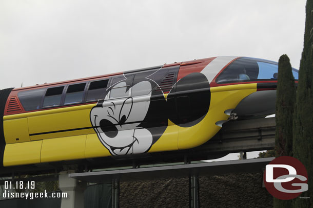 Monorail Red passing overhead.  The Monorail Fleet now features Mickey Mouse wraps for Get Your Ears on.