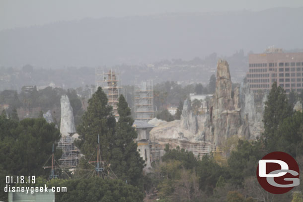 Star Wars: Galaxy's Edge rising in the distance.