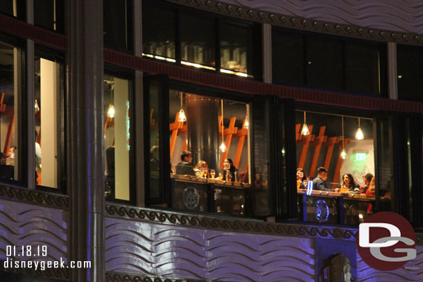 Guests at the counter overlooking Downtown Disney