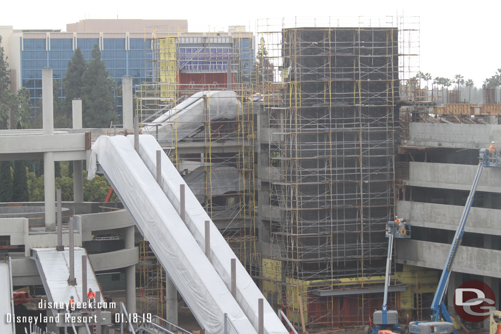 The two elevator structures are surrounded by scaffolding and are taking shape.