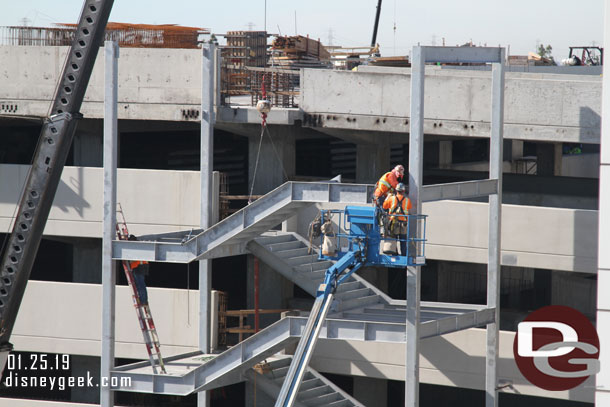 A closer look at the team assembling the stairs.