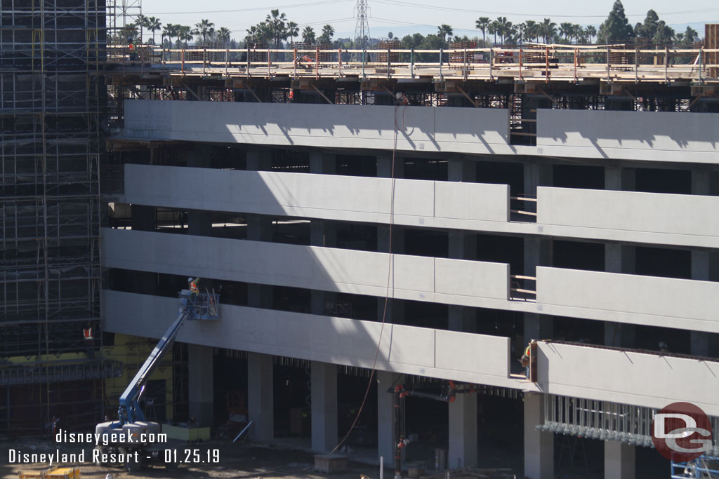 Panning across the structure.  Supports for the 6th floor/roof level are in place.  Crews are still working on the tram area facing side.