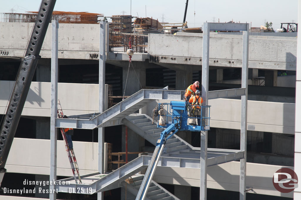 A closer look at the team assembling the stairs.