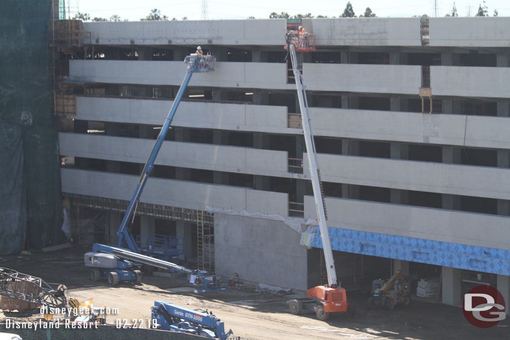 The forms are removed from the top level now and crews were sanding, sealing/painting the concrete.