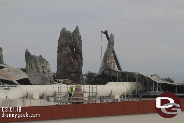 The crane in the background was moving around, but I could not see what was being moved.