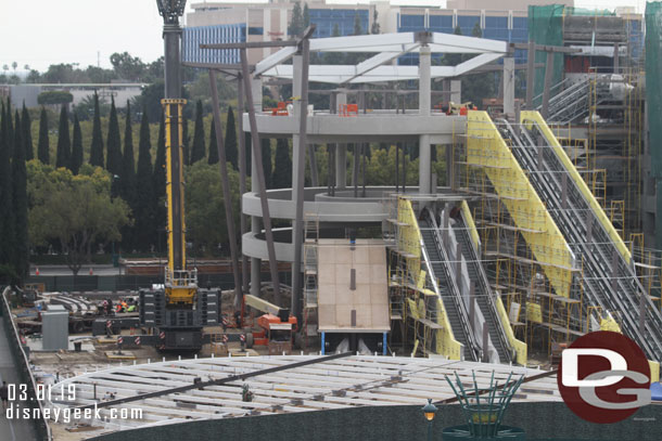 The supports for the roof structure have been lifted into place but the main section is still on the ground.