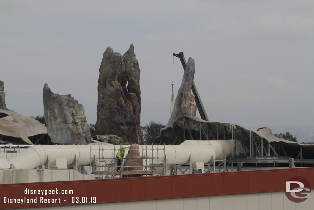The crane in the background was moving around, but I could not see what was being moved.