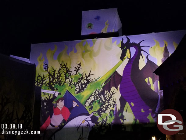 Lights on the Fantasyland side scaffolding scrim.