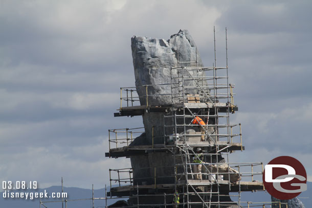 A closer look at crews working on the one formation that has the most scaffolding still.