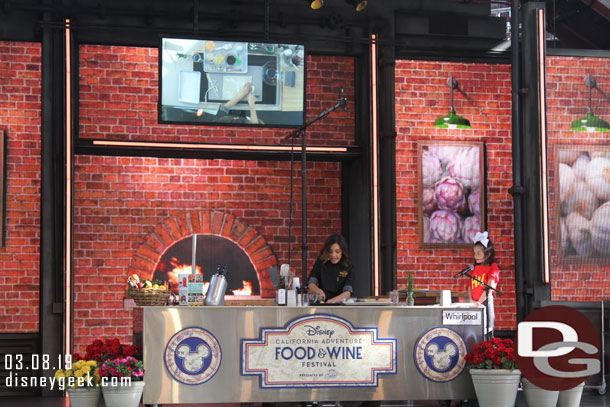 A chef leading a guest through a cooking demonstration.  They made three different snacks.