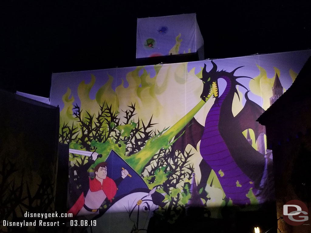 Lights on the Fantasyland side scaffolding scrim.