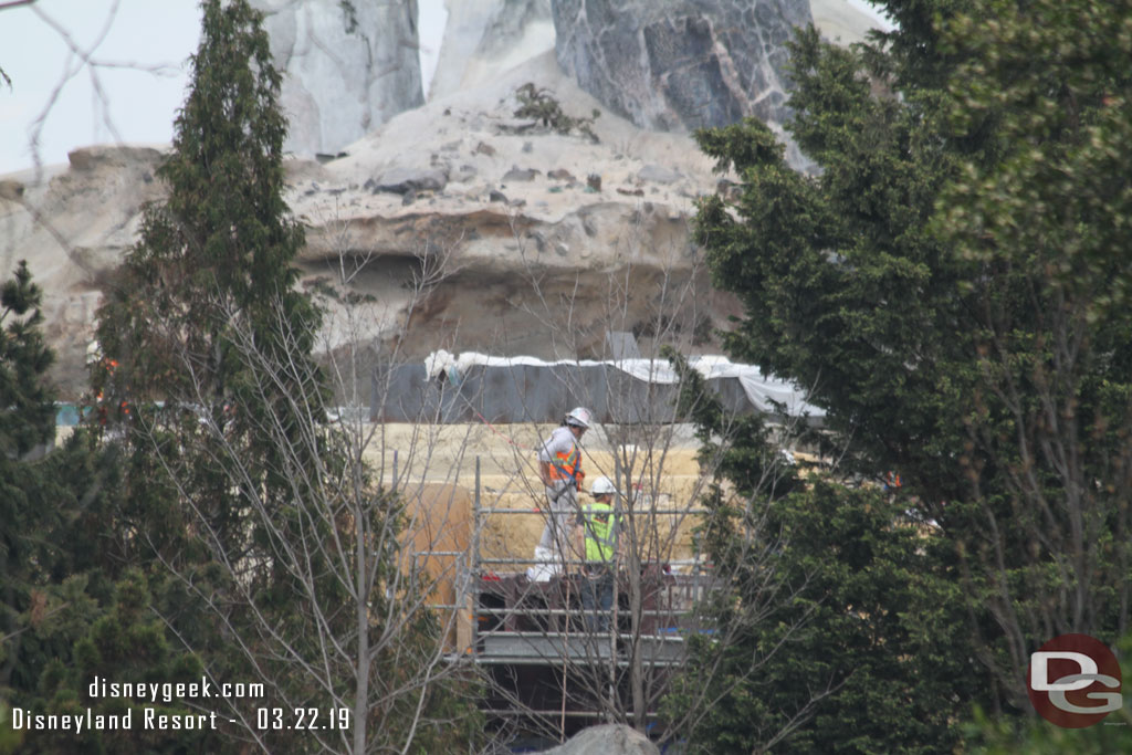 Through the trees you catch glimpses of crews finishing up buildings within Black Spire Outpost.