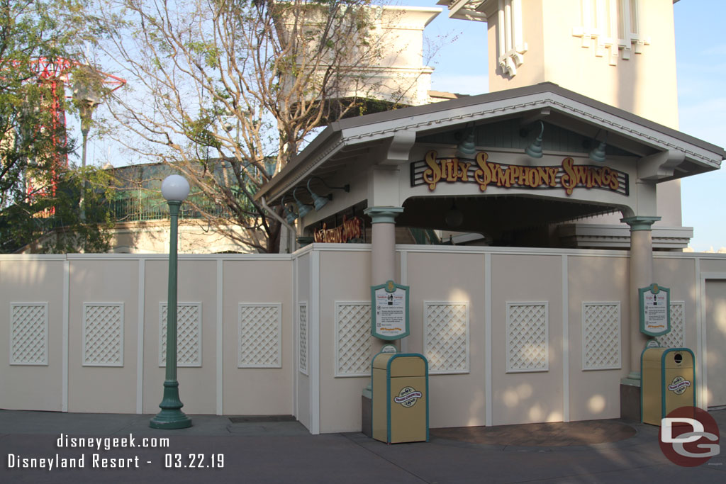 The Silly Symphony Swings has walls around the steps and queue area.