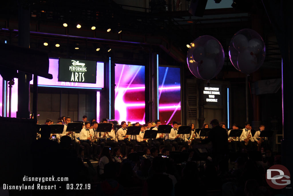 Hollencrest Middle School Wind Ensemble performing on the backlot stage.
