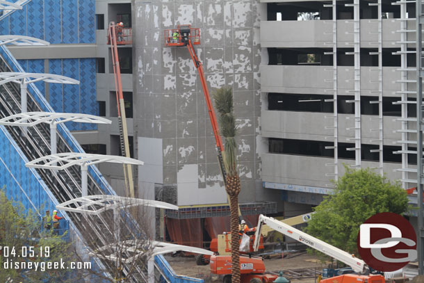 The elevator structure has the scaffolding removed and it appears they are removing the paint.