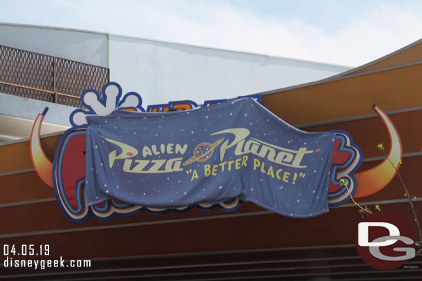 Wonder how long the temporary looking Pizza Planet sign will stay around.