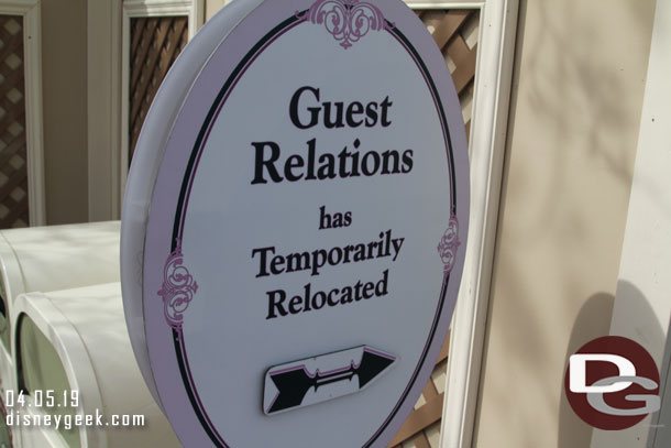 A sign near Jolly Holiday pointing to the temporary guest relations area.