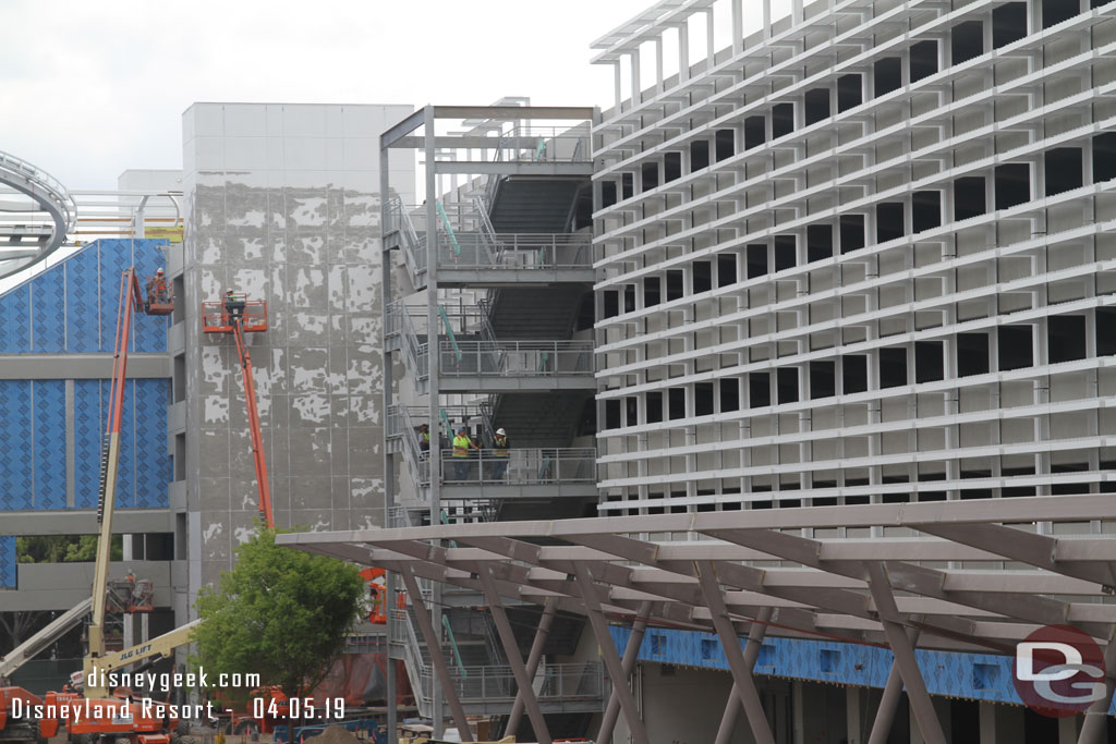 Scaffolding is removed from the elevator tower in the background.  Crews working on the stairs.