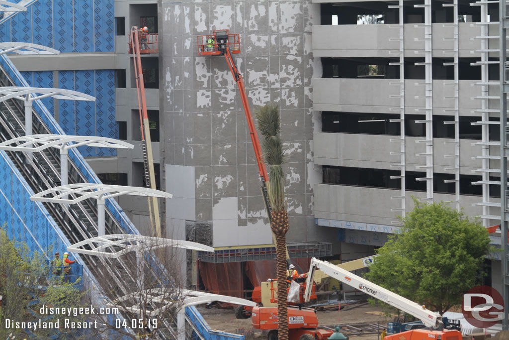 The elevator structure has the scaffolding removed and it appears they are removing the paint.