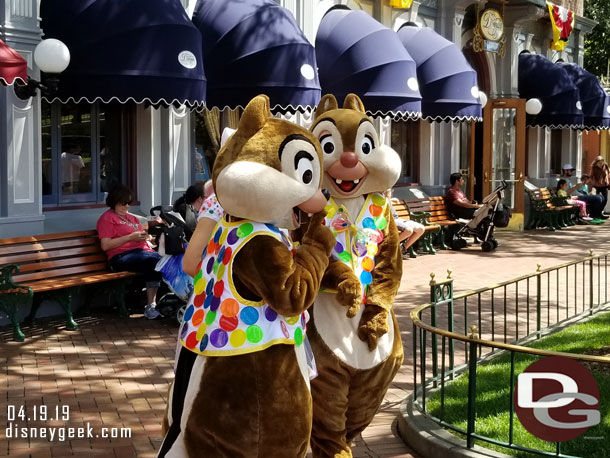 Chip and Dale meeting guests in Town Square