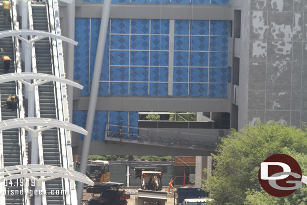 Panels being installed on the span between the escalators and elevators.