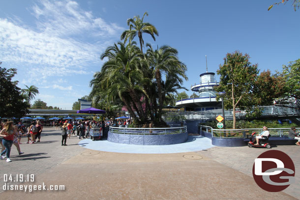 In Tomorrowland the walls are down from near the Autopia Exit.  The planter has been trimmed back and a new path behind it added.  Here you can see the new concrete color around the reduced planter.