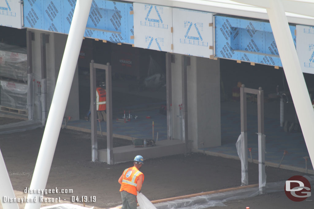 A closer look.  Assuming the gates will attach to the outer poles and then swing toward the structure to open.  If that guess is correct, then once you step inside is where the bag check tables and metal detectors will be.