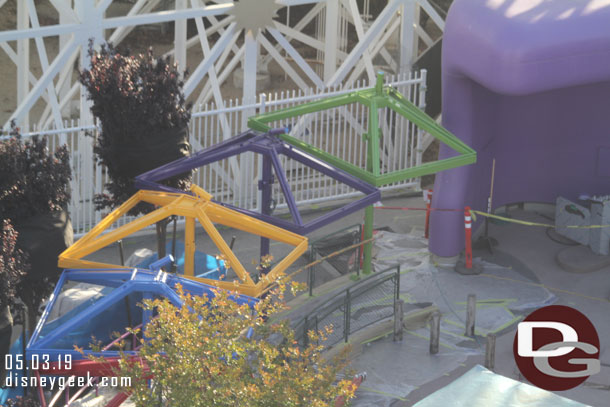 The queue shade structures for the Inside Out Emotional Whirlwind is being painted.