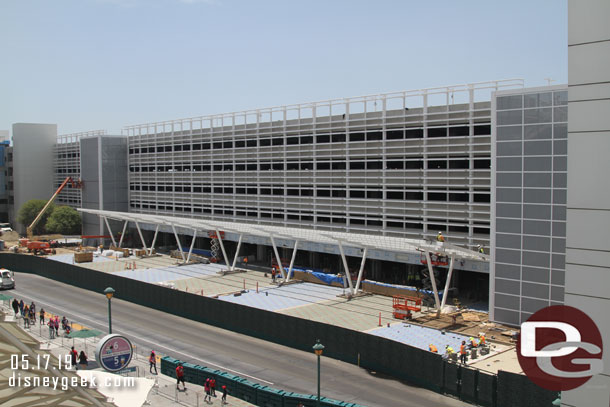 They are installing elements for the shade structure for the security queues and more pavers are being installed.