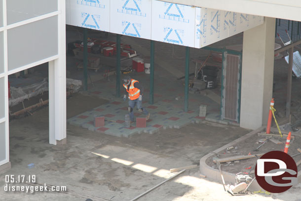 Looking into the structure fencing and pavers are being installed.