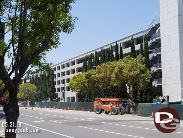 The trees appear to be all in now and work on the sidewalk, gate, and other landscaping is underway.