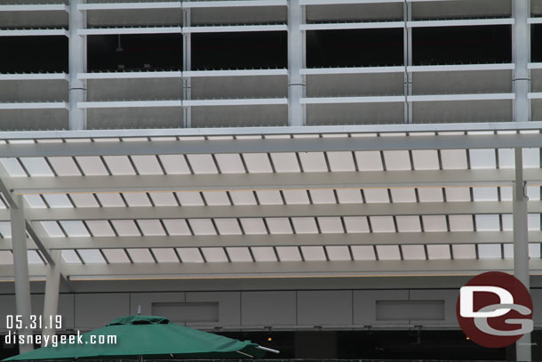 A closer look at the roof of the queue shade structure.  Assuming those cut out boxes will be indicators if the lane is open.